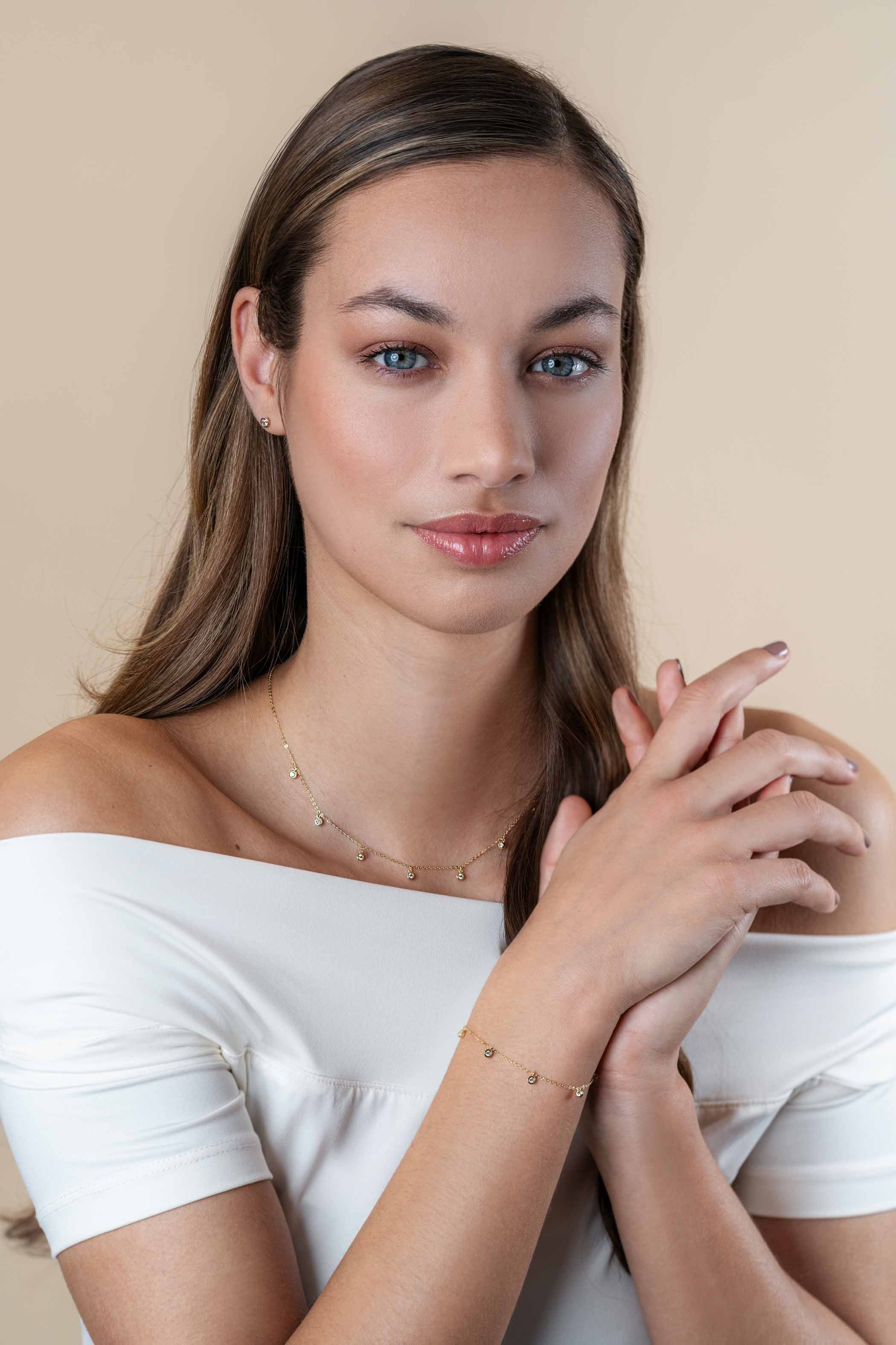 ZINZI Gold 14 krt gouden armband met zeven ronde hangertjes. bezet met witte zirconia's 15.5-18.5cm ZGA451